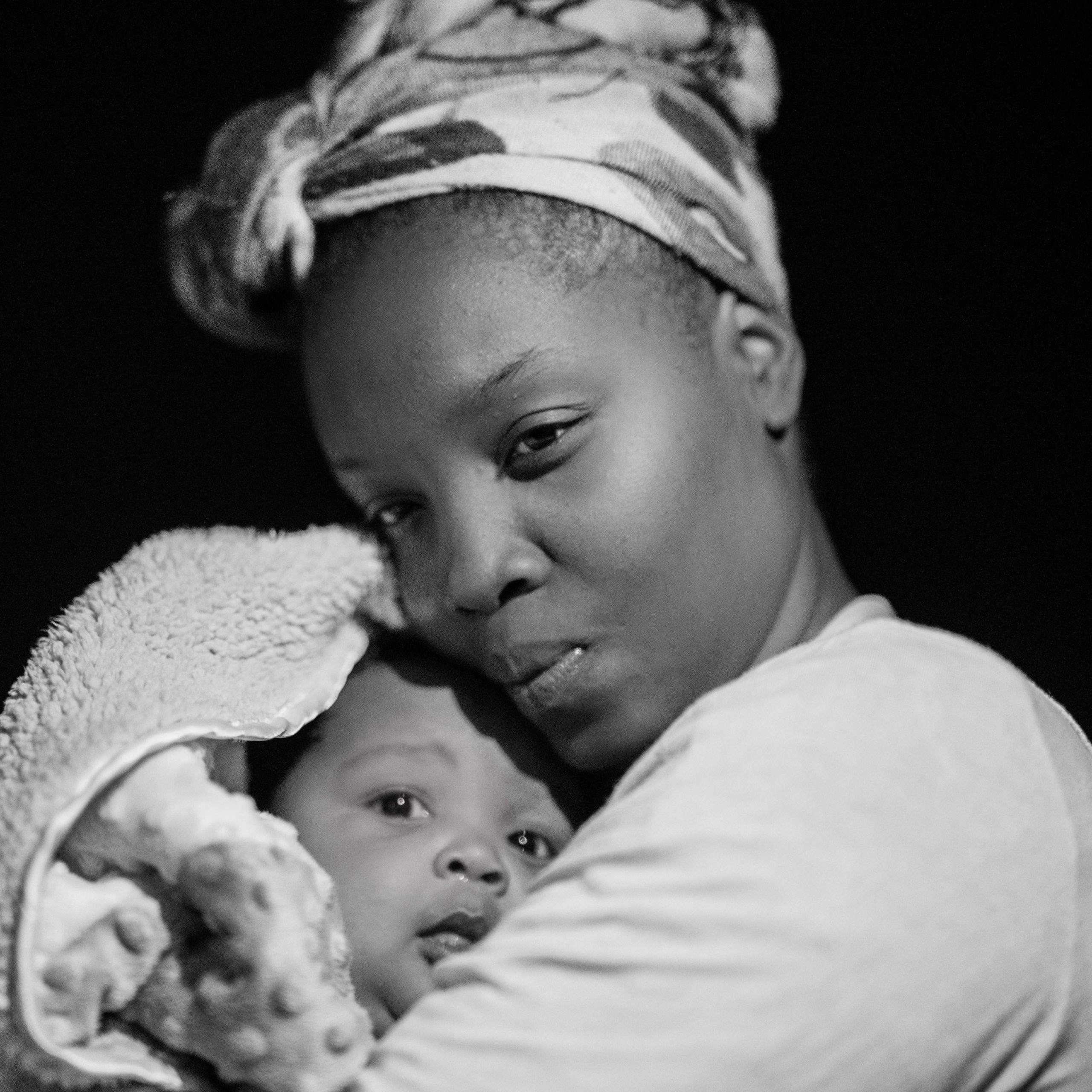 Black woman holding baby
